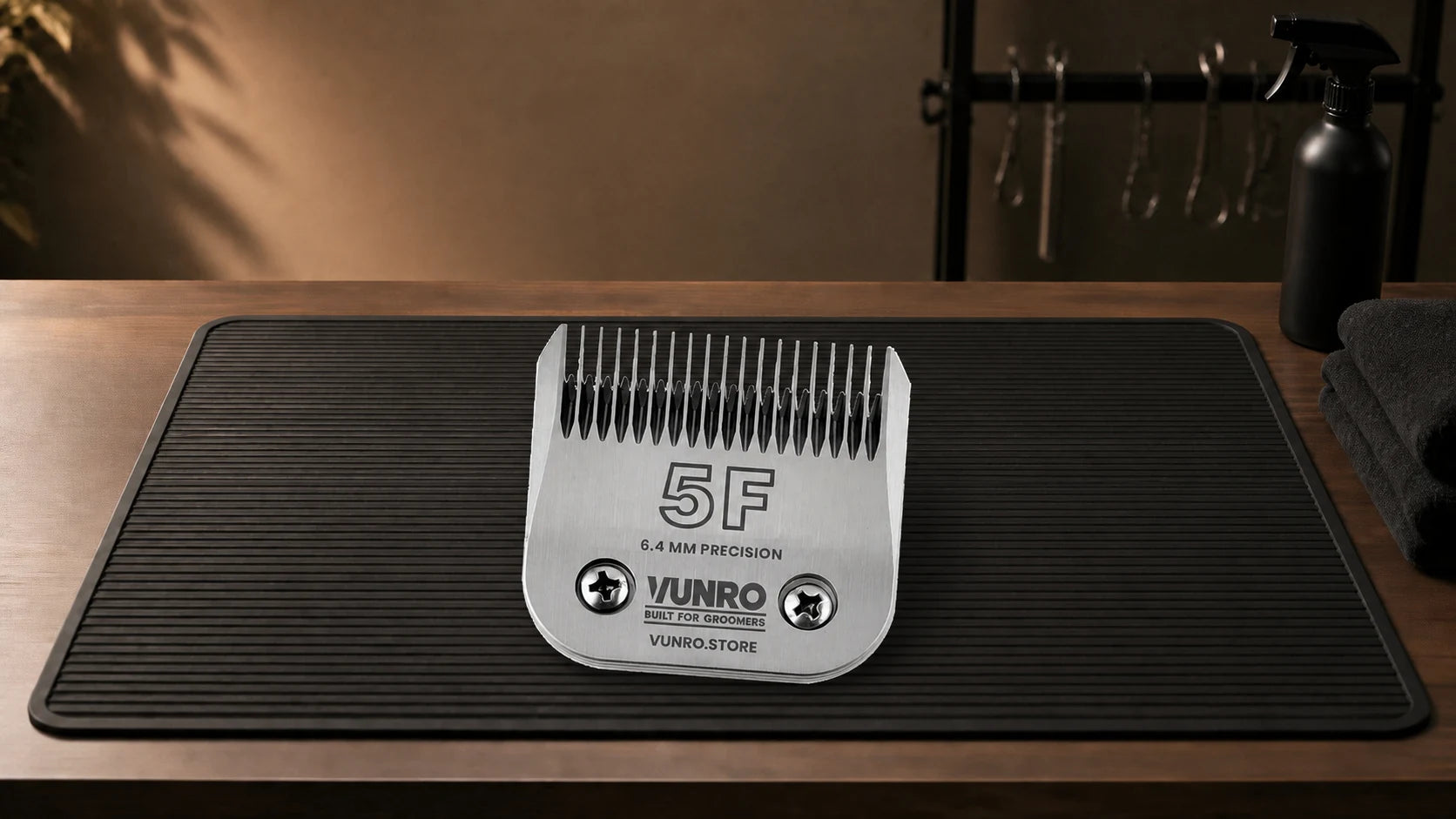 #5F Dog Clipper Blade (6.4 mm) resting naturally on the VUNRO grooming workbench